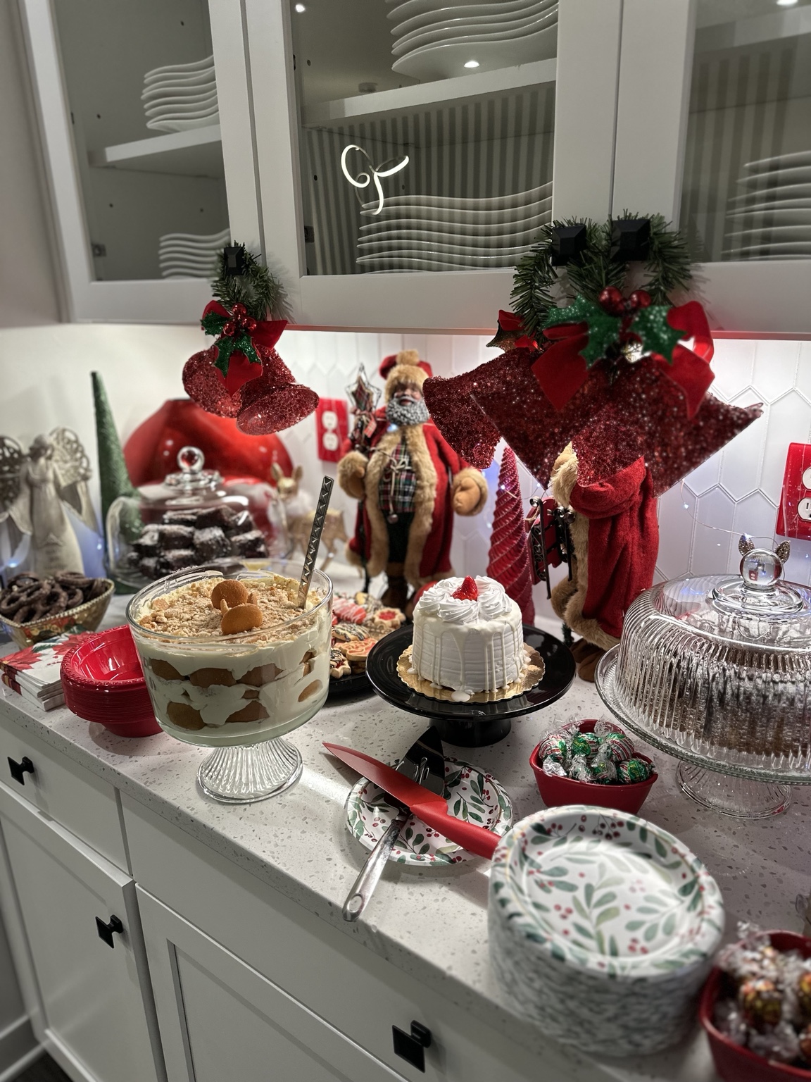 Full gathering table set with desserts and serving pieces